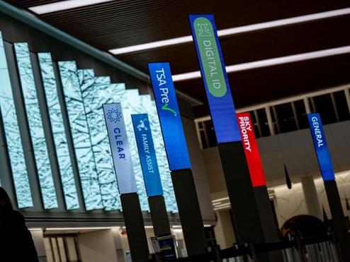 An airport with different check ins, including Delta's Digital ID.